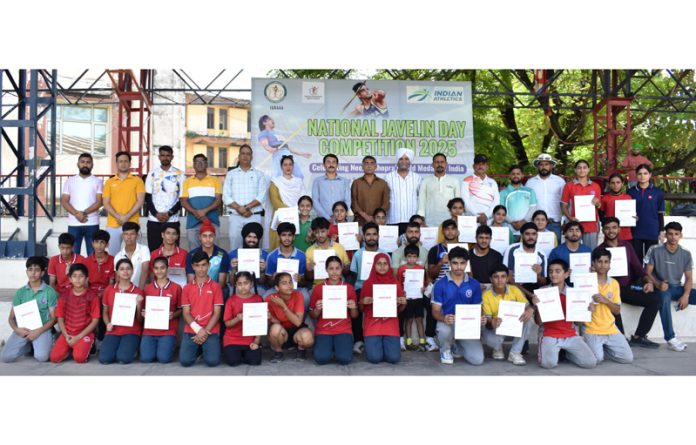 Athletes displaying certificates while posing with dignitaries post match presentation.