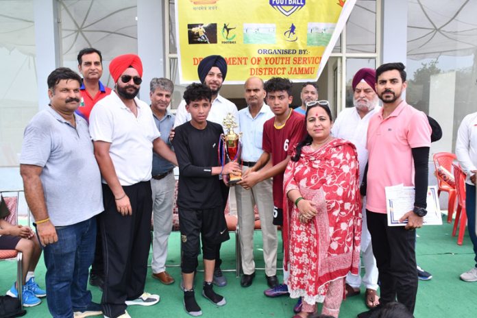 Players receiving winning trophy during prize distribution ceremony at Nagrota. Players receiving winning trophy during prize distribution ceremony at Nagrota.