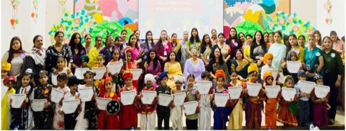 Winners posing along with certificates alongside dignitaries during a programme.