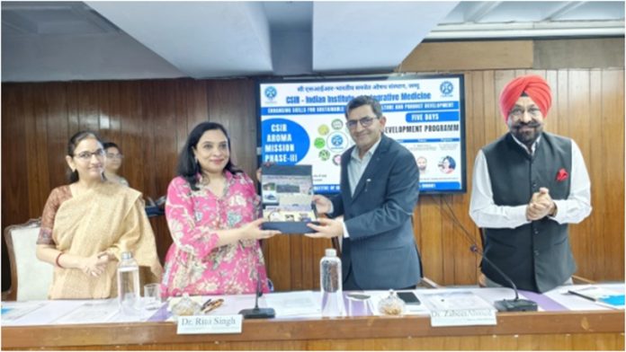 Chief guest Dr Ritu Singh receiving memento from a dignitary.