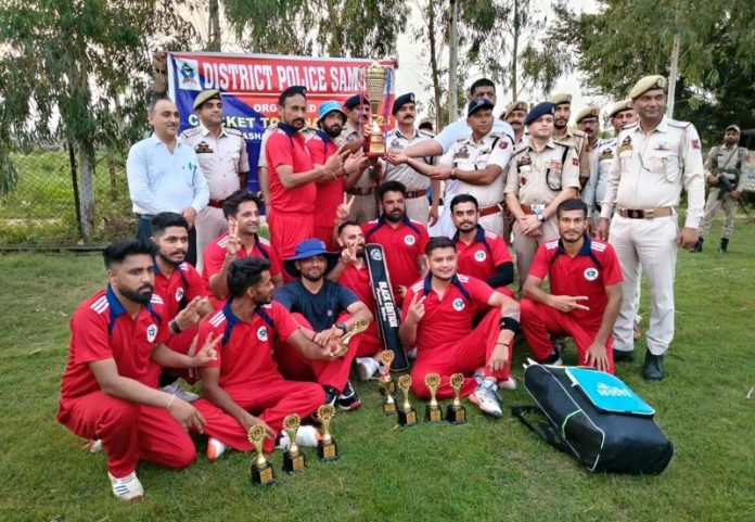 Officers presenting trophy to winning team.