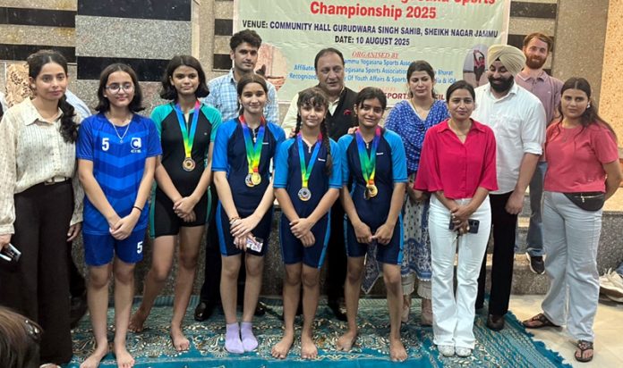 Yoga athletes posing along with dignitaries.