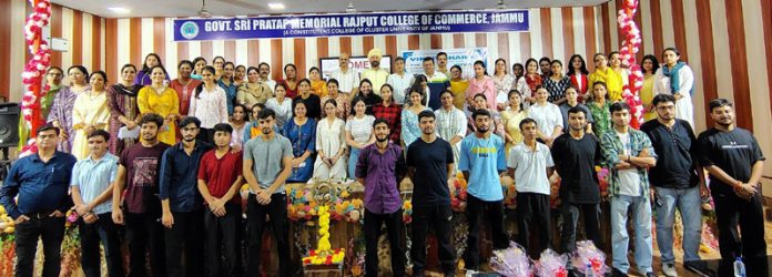 Students posing along with teaching faculty.