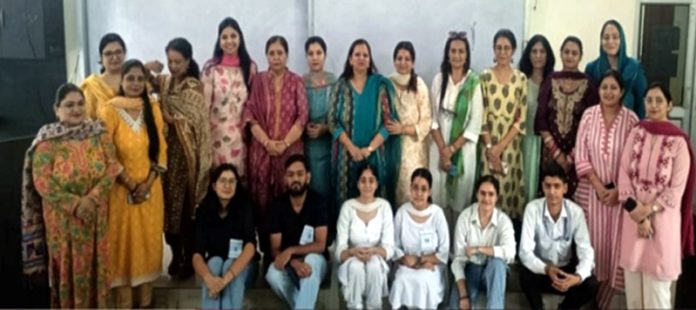 Students posing along with teaching staff.