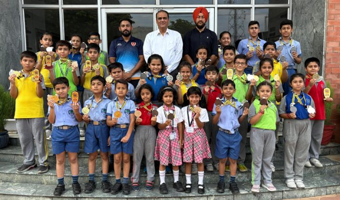 Students of Heritage school posing along with dignitaries. Students of Heritage school posing along with dignitaries.