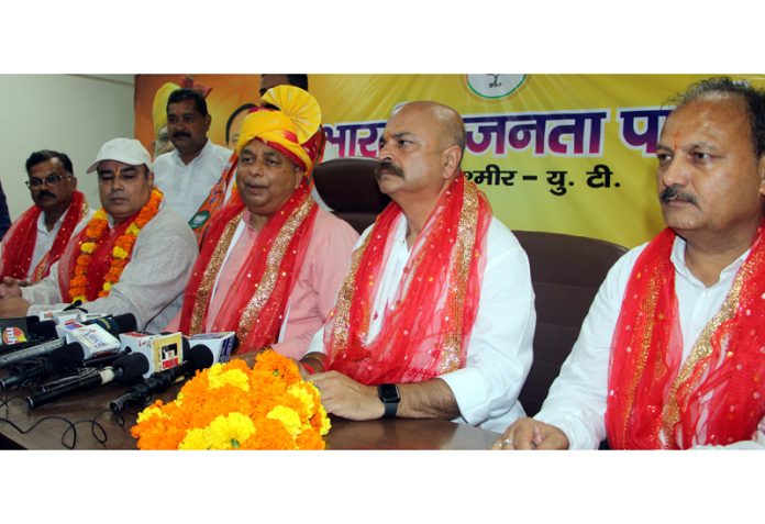 BJP president, Sat Sharma along with MLA Jammu East, Yudhvir Sethi talking to reporters at Jammu on Friday. -Excelsior/Rakesh