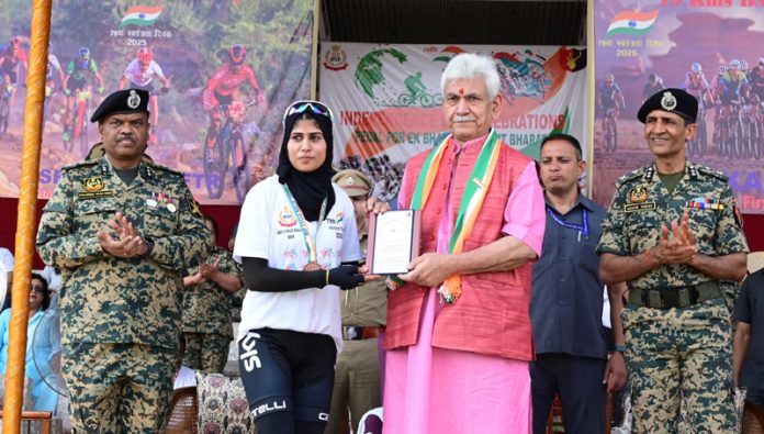 LG Manoj Sinha felicitating participant of Cycle Rally organised by BSF.