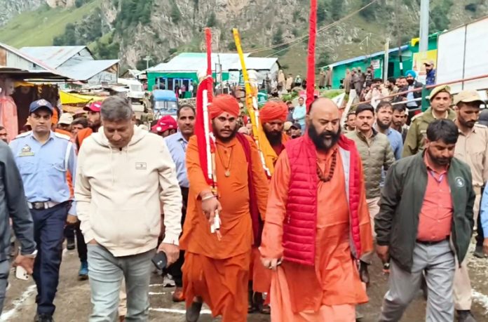 Holy mace of Shri Amarnath Ji, led by Mahant Deependra Giri Ji on way to Chandanwari from Pahalgam on Wednesday. Holy mace of Shri Amarnath Ji, led by Mahant Deependra Giri Ji on way to Chandanwari from Pahalgam on Wednesday.