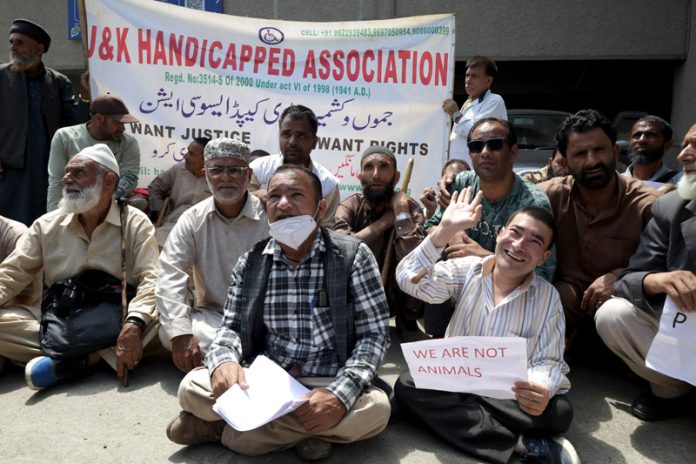 Members of J&K Handicapped Association during a protest in Srinagar on Monday. —Excelsior/Shakeel