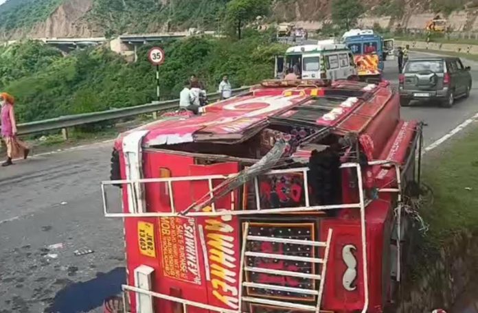 A minibus turns turtle on the road in Chenani area of Udhampur.