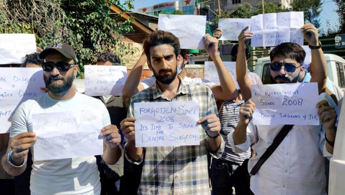 Unemployed dental surgeons during a protest in Srinagar on Wednesday. -Excelsior/Shakeel