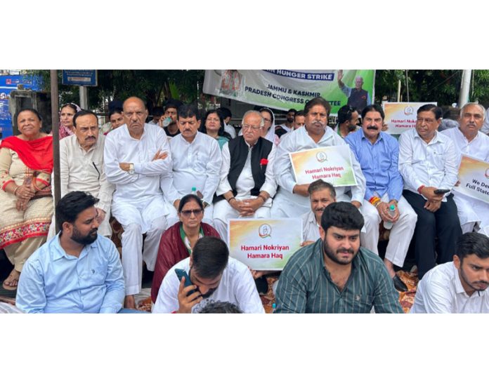 Cong leaders and workers staging protest dharna in Jammu on Wednesday.