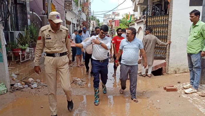 JMC Commissioner inspecting flood-affected area on Thursday.