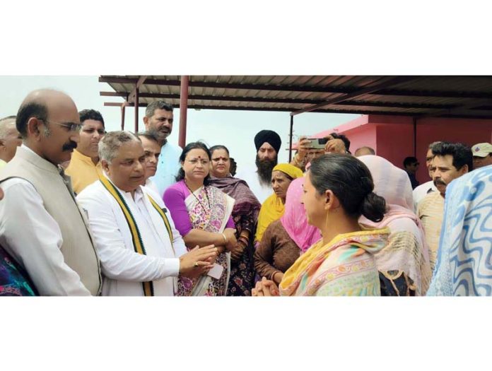 BJP leaders talking to flood victims at Akhnoor on Friday. BJP leaders talking to flood victims at Akhnoor on Friday.