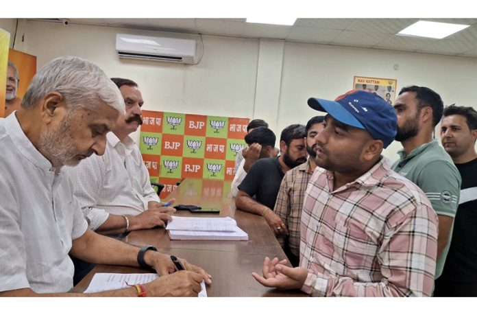 MLA Jammu North Sham Lal Sharma during a public darbar at BJP Office, Trikuta Nagar on Friday.