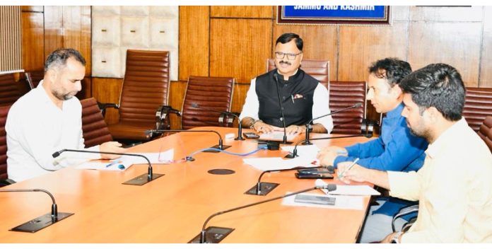 Minister Javed Rana chairing a meeting on Thursday.