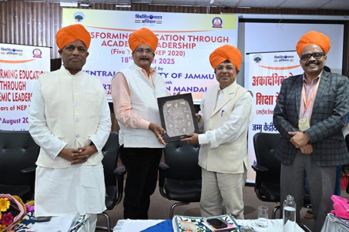 CUJ Vice-Chancellor presenting memento to Shantmanu, Addl Chief Secretary HED during the conference.