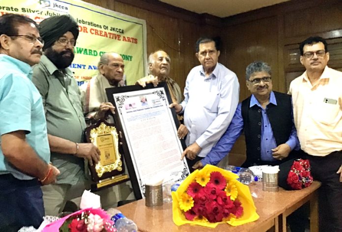 Virendra Singh Rahi being conferred upon Life Time Achievement Award of JKCCA at New Delhi.