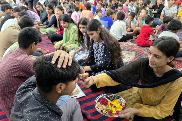 Inmates tying Rakhi at Bal Ashram Jammu on the occasion of Raksha Bandhan on Saturday. -Excelsior/Rakesh Inmates tying Rakhi at Bal Ashram Jammu on the occasion of Raksha Bandhan on Saturday. -Excelsior/Rakesh