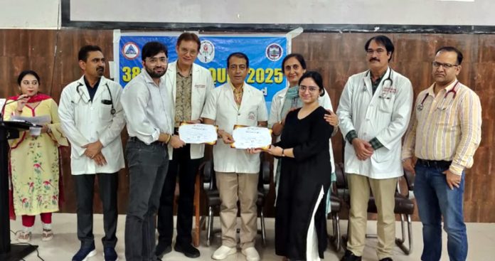 HoD Pediatrics and Superintendant SMGS Hospital awarding winners of contest. HoD Pediatrics and Superintendant SMGS Hospital awarding winners of contest.