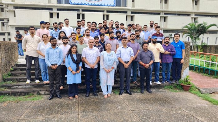 Dean of Research Studies in JU, Prof Neelu Rohmetra and others posing together during an event at Dhanvantari Library premises.