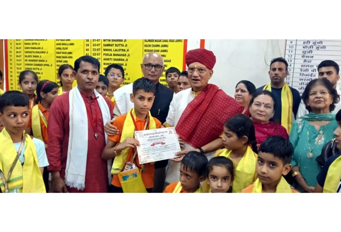 Former JMC Mayor Rajinder Sharma along with other dignitaries and students at Panchmukhi Hanuman Mandir in Jammu.