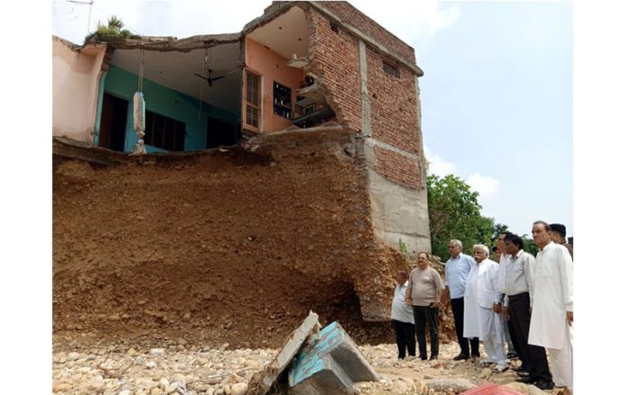 Senior NC leader Ajay K Sadhotra taking stock of losses due to flash floods in lower Gurah Brahmana (Bantalab), Jammu.