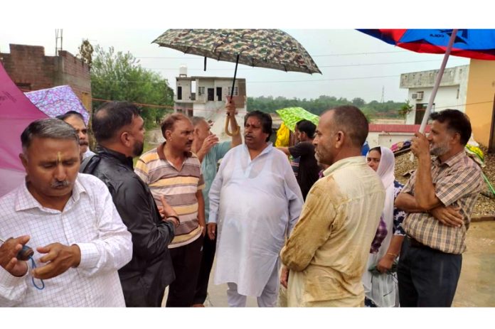 Cong leader Raman Bhalla during visit to rain hit areas of Jammu South.