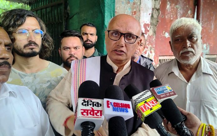 Ex Mayor, Rajinder Sharma talking to reporters at Jammu on Sunday. -Excelsior/Rakesh