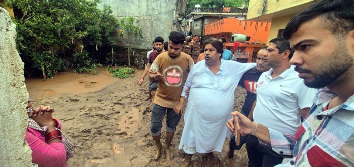 Raman Bhalla during a visit to flood affected area.