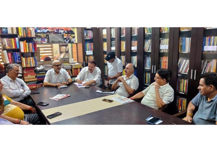 MLA Jammu North Sham Lal Sharma listening public grievances at party headquarters Jammu on Friday.