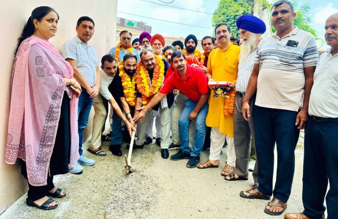 MLA Bahu, Ch Vikram Randhawa kick starting work of lane and drain at Preet Nagar on Friday.