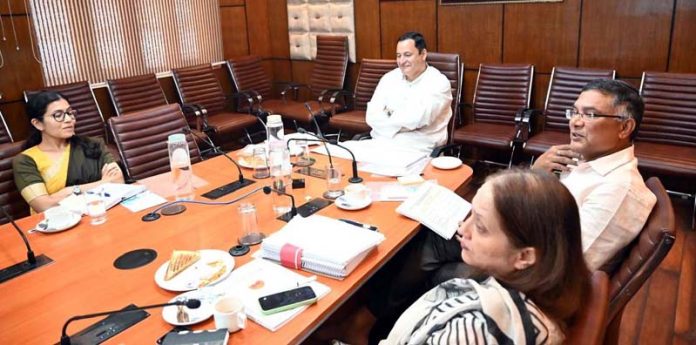 Minister Javed Ahmad Dar chairing a meeting at Srinagar on Monday.