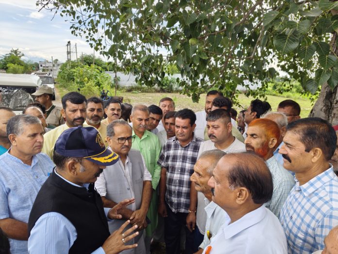 Former Dy CM, Dr Nirmal Singh and MLA Akhnoor, Mohan Lal during visit to flood hit areas of Pargwal on Saturday.