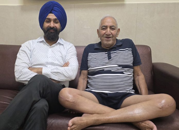 Dr Ranjit Singh posing with a patient on whom he performed bilateral knee replacement surgery.