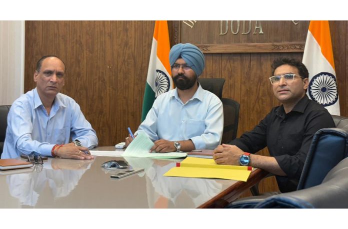 DC Doda Harvinder Singh chairing a meeting on Friday.