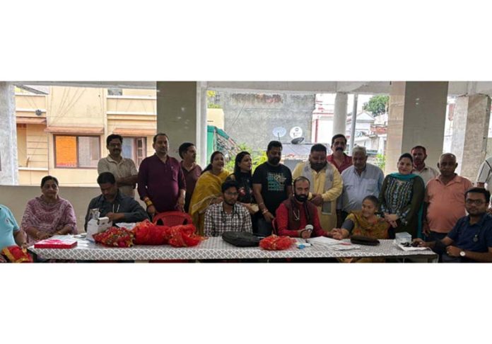 HoD Cardiology GMC & SSH Jammu Dr Sushil Sharma examining patients at Rehari Colony on Sunday.