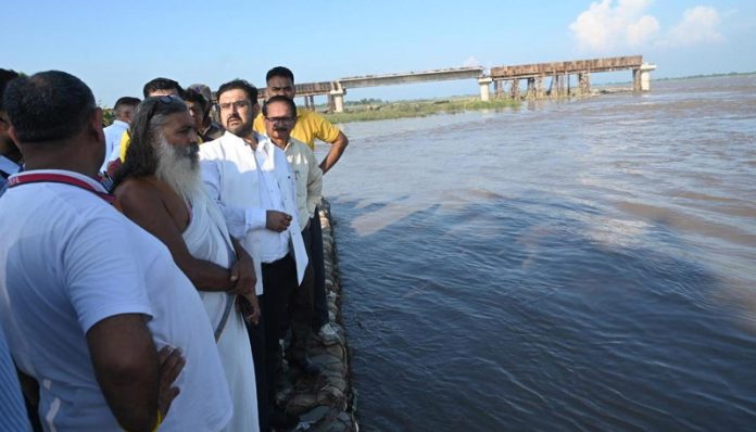 Minister Satish Sharma visiting flood-affected areas of Chhamb Constituency on Thursday.