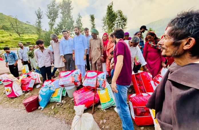 MLA Bani, Dr Rameshwar Singh distributing relief material in rain hit area of Duggani on Saturday.