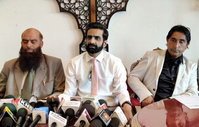 Members of J&K Hotel and Restaurant Association during a press conference in Srinagar on Saturday.