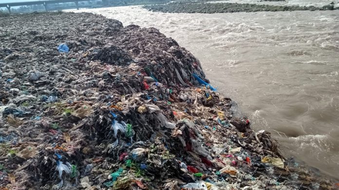 A large heap of garbage dumped at river bank near S K Bridge in Poonch. A large heap of garbage dumped at river bank near S K Bridge in Poonch.