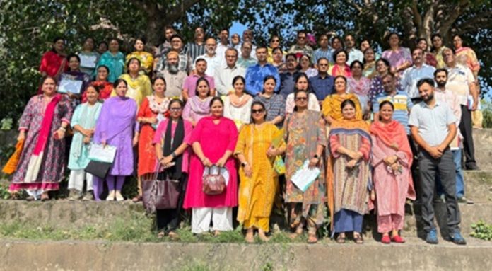 Dignitaries posing for a group photograph during a programme organized by DIET in Jammu.