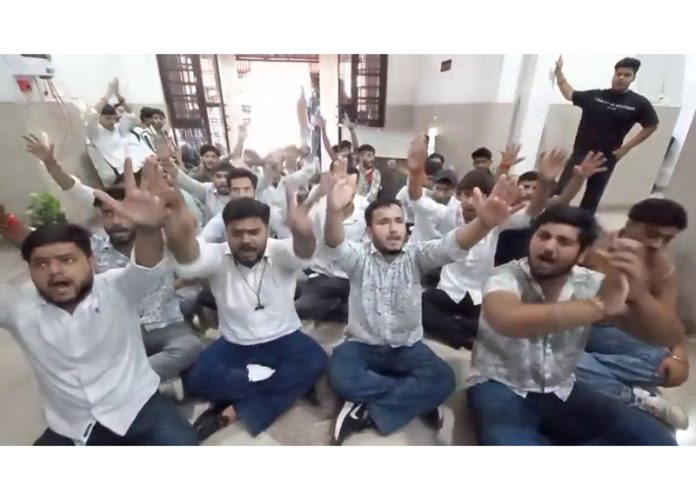 Students protesting at Cluster University Jammu on Monday.