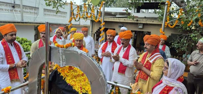 Arti being performed by Pandits during Sthapna Divas of Shri Shani Dev Shila at Laxmi Narayan Mandir on Sunday.