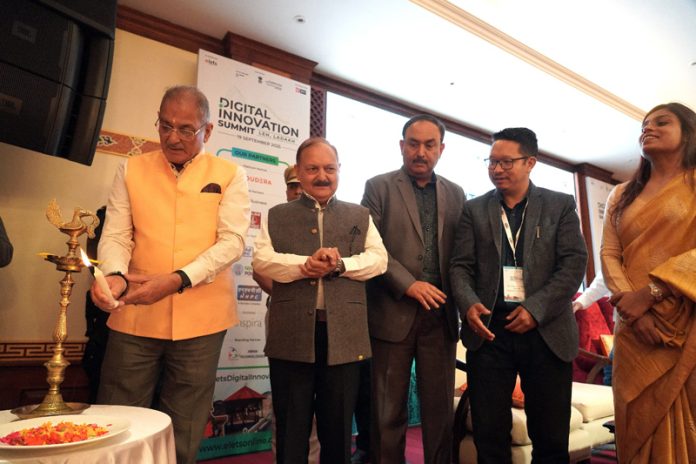 LG Kavinder Gupta lightening the traditional lamp during an event held in Leh.