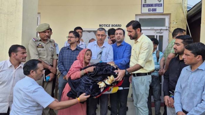 DC Kathua distributing relief material among affected families in Bani Sub Division.