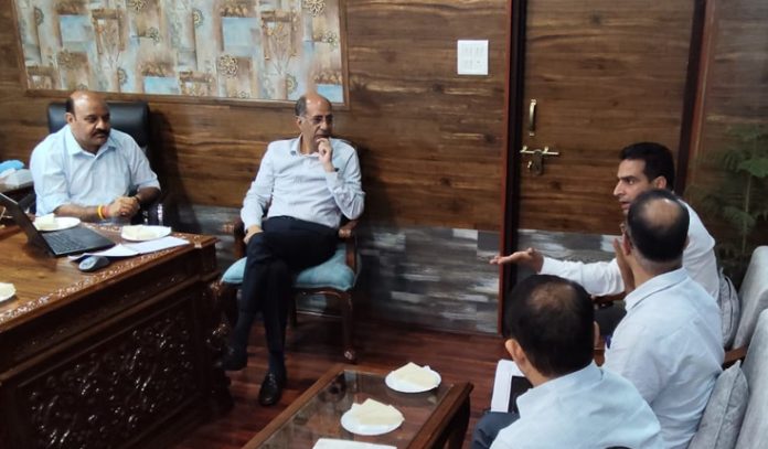 Dy CM Surinder Choudhary chairing a meeting to review the progress on the widening of Boulevard Road Project.