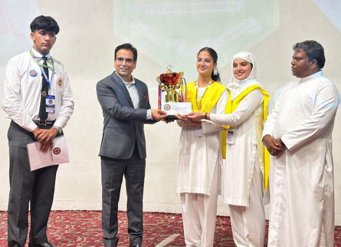 MLA Zadibal Tanvir Sadiq presenting trophy to winners.