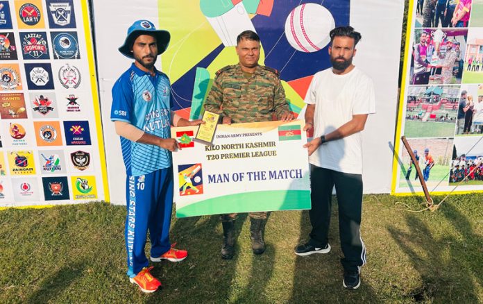 A player receiving man of the match award from a dignitary. A player receiving man of the match award from a dignitary.