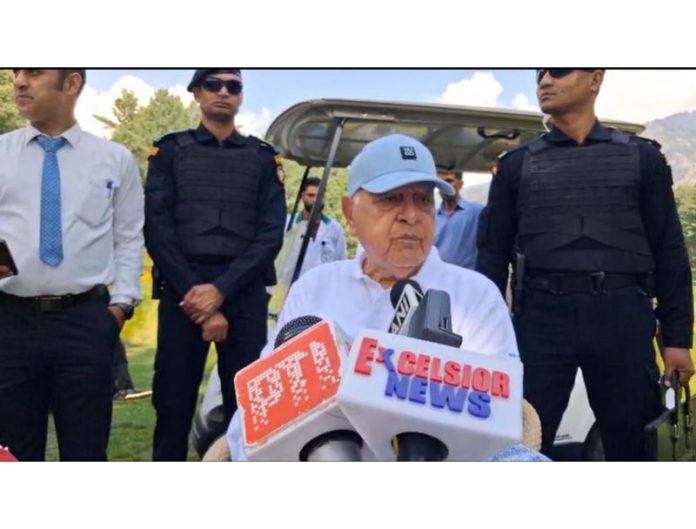 NC president Dr Farooq Abdullah speaking to reporters in Pahalgam. -Excelsior/Sajad Dar